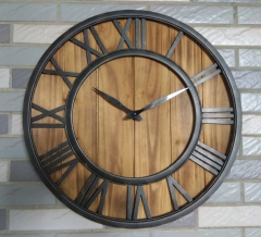 Antique black iron framed wooden wall clock
