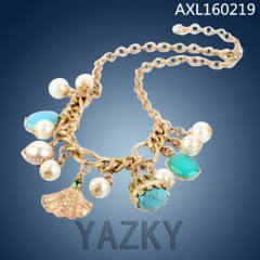 Fashion necklace with pearls and shells pendants