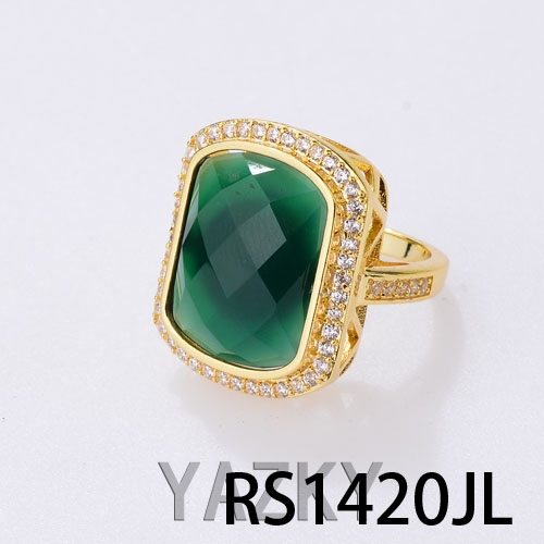 Green big stone in gold color with zircon