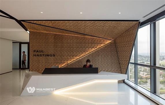 The white front desk receives special artificial stone with LED