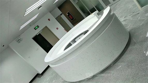 Round artificial stone large reception desk on the hall