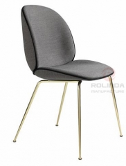 Danish design replicates the golden leg furniture of the Guppy Beetle dining chair