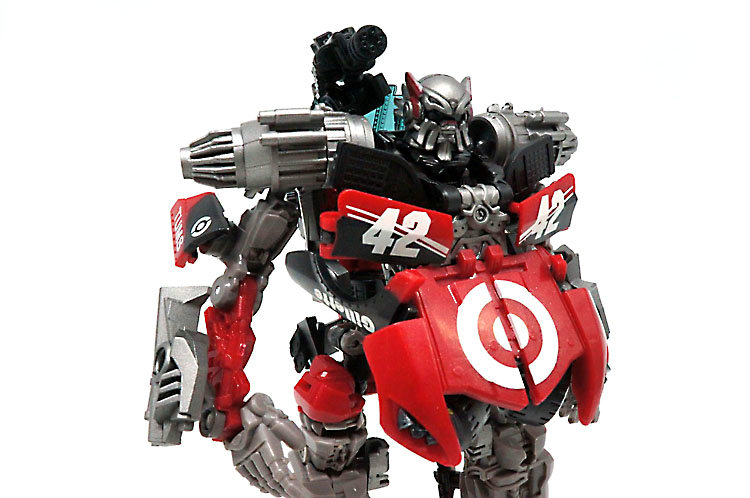 Red robot warrior in action pose with missiles and guns Red robot warrior in action pose with missiles and guns