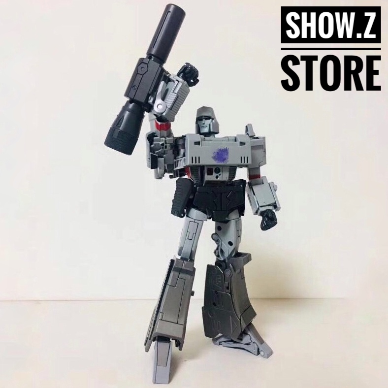 Gray and black Megatron robot with cannon weapon Gray and black Megatron robot with cannon weapon