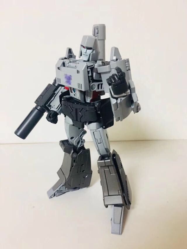 Gray military-style robot with cannon and rifle weapons Gray military-style robot with cannon and rifle weapons