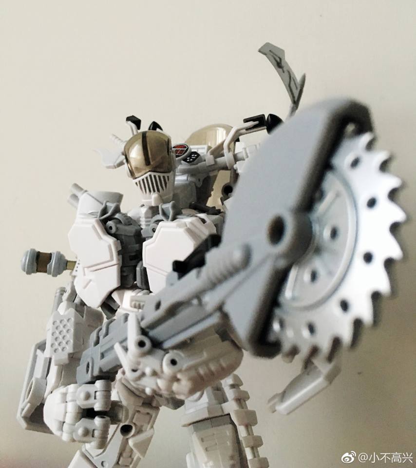 White and grey modular robot featuring motorcycle transformation capability White and grey modular robot featuring motorcycle transformation capability
