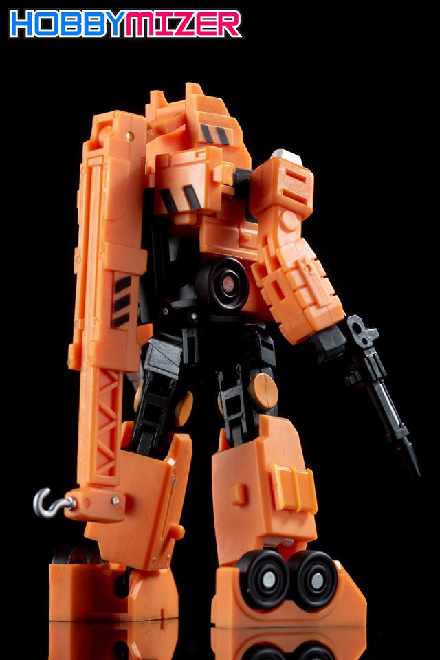 Orange crane truck transforms to standing robot character Orange crane truck transforms to standing robot character