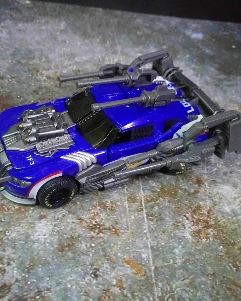 Blue and gray GOD-06 Topspin Wrecker robot in vehicle car form Blue and gray GOD-06 Topspin Wrecker robot in vehicle car form