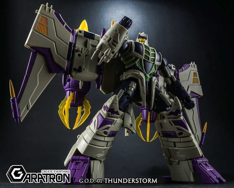 Purple and tan robot warrior with extended wing configuration Purple and tan robot warrior with extended wing configuration
