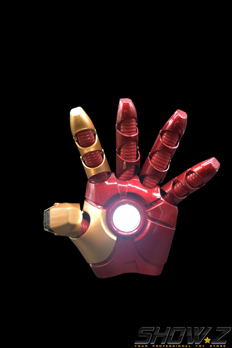 Red and gold iron man gauntlet with illuminated arc reactor Red and gold iron man gauntlet with illuminated arc reactor