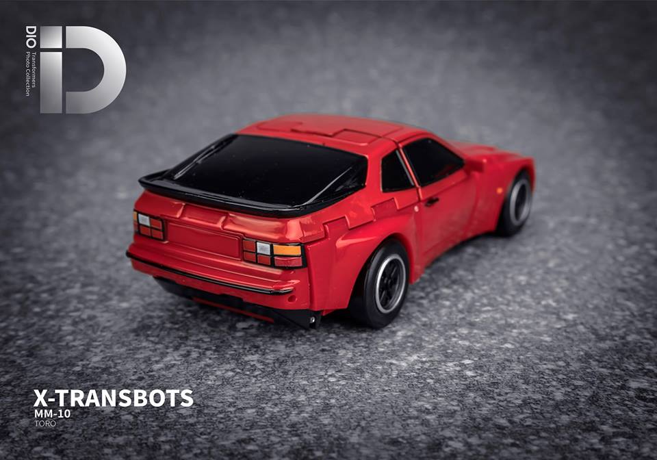 Xtransbots Toro Cliffjumper red vehicle rear angle showing wheels aerodynamic profile Xtransbots Toro Cliffjumper red vehicle rear angle showing wheels aerodynamic profile