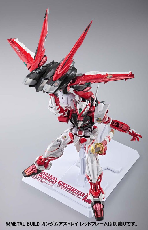 Red and white SEED Gundam in dynamic fighting stance Red and white SEED Gundam in dynamic fighting stance