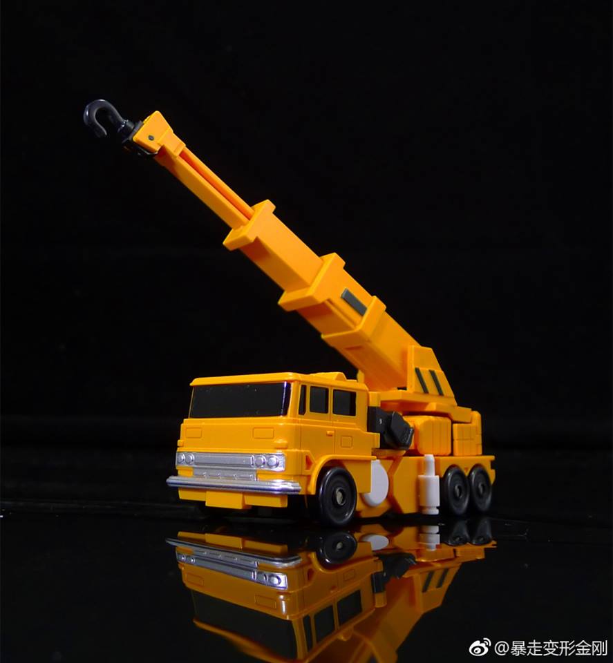Yellow and orange truck-based transformer with extended crane Yellow and orange truck-based transformer with extended crane