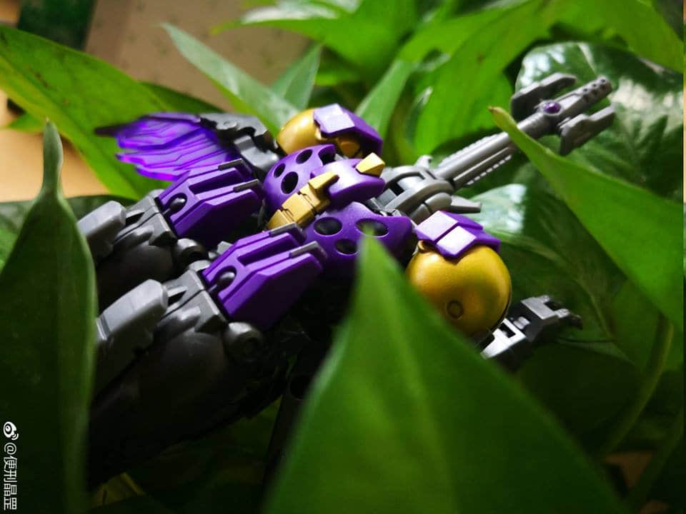 Detailed purple and yellow robot warrior figure in action stance Detailed purple and yellow robot warrior figure in action stance