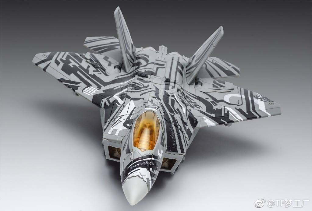 Gray robot with extended wings and articulated limb armor visible Gray robot with extended wings and articulated limb armor visible