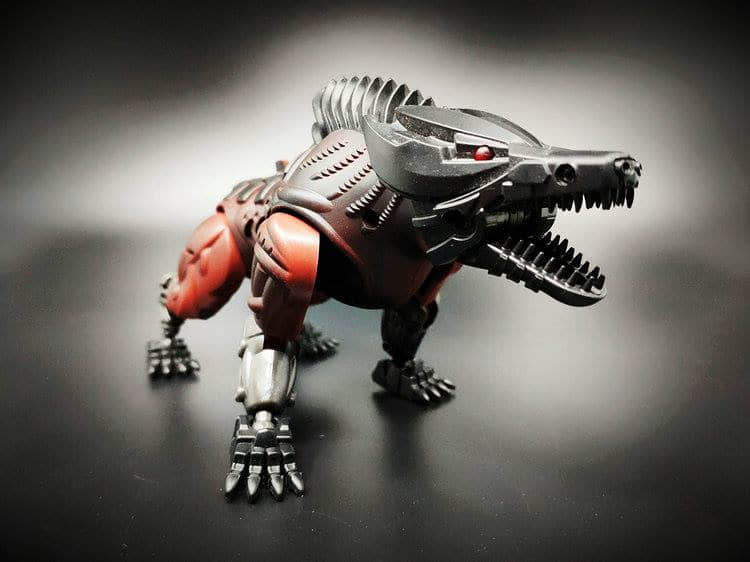 Red and white steeljaw robot figure in action warrior stance display Red and white steeljaw robot figure in action warrior stance display