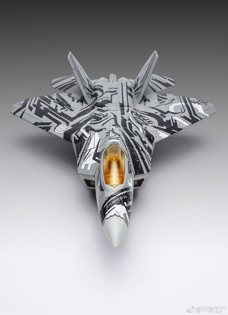 Mechanical suit with deployed wings and weapon systems highlighted Mechanical suit with deployed wings and weapon systems highlighted
