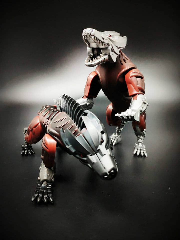 Two steeljaw animal beast mode robots displayed side by side positions Two steeljaw animal beast mode robots displayed side by side positions