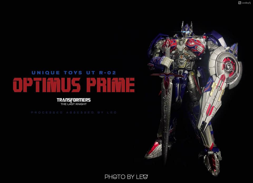 Standing Optimus Prime figure with illuminated details against dark background Standing Optimus Prime figure with illuminated details against dark background