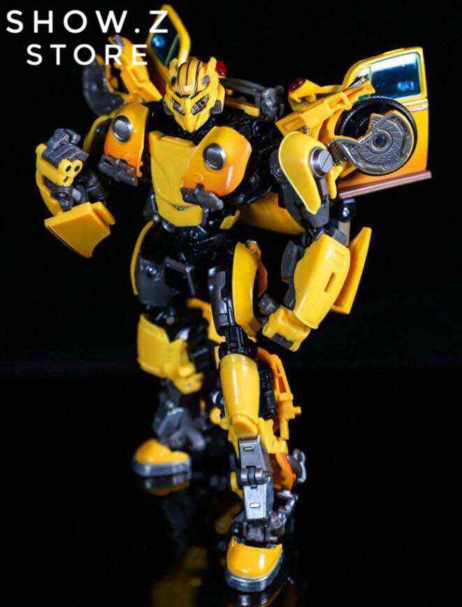 Yellow bee robot with articulated limbs and chrome accessories Yellow bee robot with articulated limbs and chrome accessories