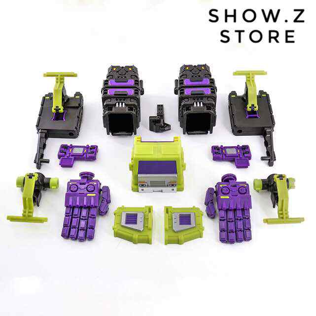 Purple and lime green Stunticons combiner robot components laid out flatly Purple and lime green Stunticons combiner robot components laid out flatly