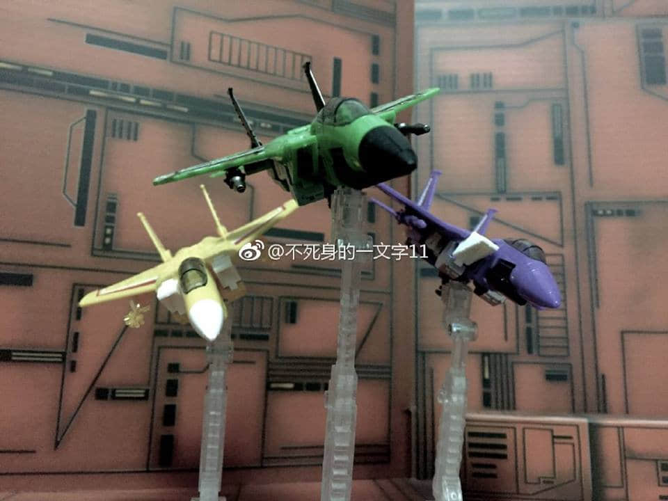 MechFansToys F03 Overload multi-colored fighter jets in flight display MechFansToys F03 Overload multi-colored fighter jets in flight display