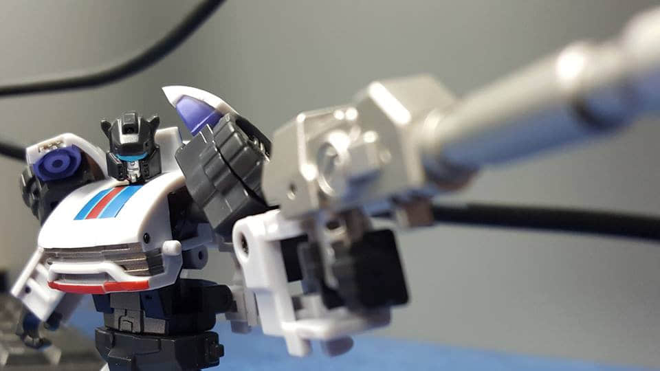Small white blue robot racing vehicle transformation action figure Small white blue robot racing vehicle transformation action figure