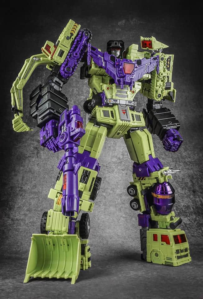 Purple yellow green robot in transformation pose with large treads Purple yellow green robot in transformation pose with large treads