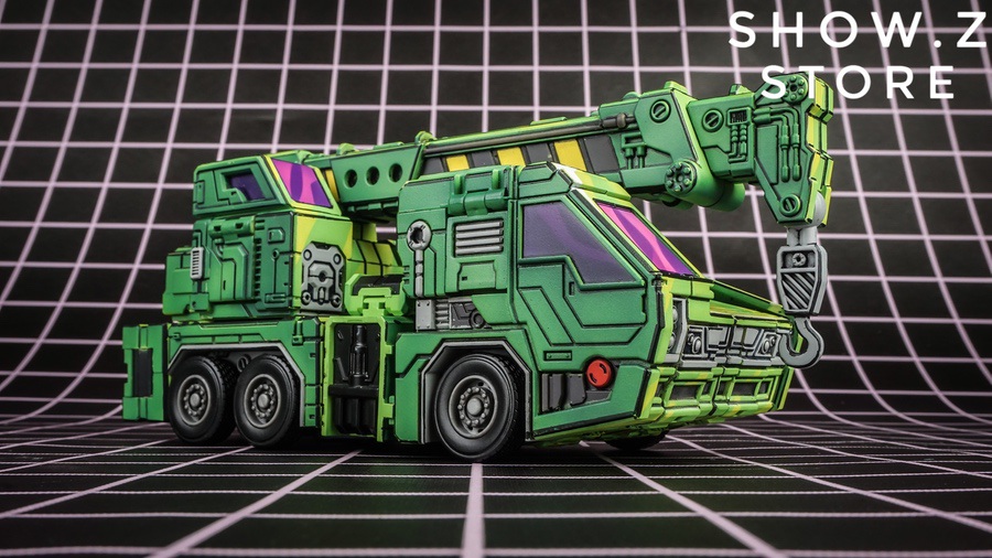 Constructor green and purple robot figure with construction vehicle components visible Constructor green and purple robot figure with construction vehicle components visible