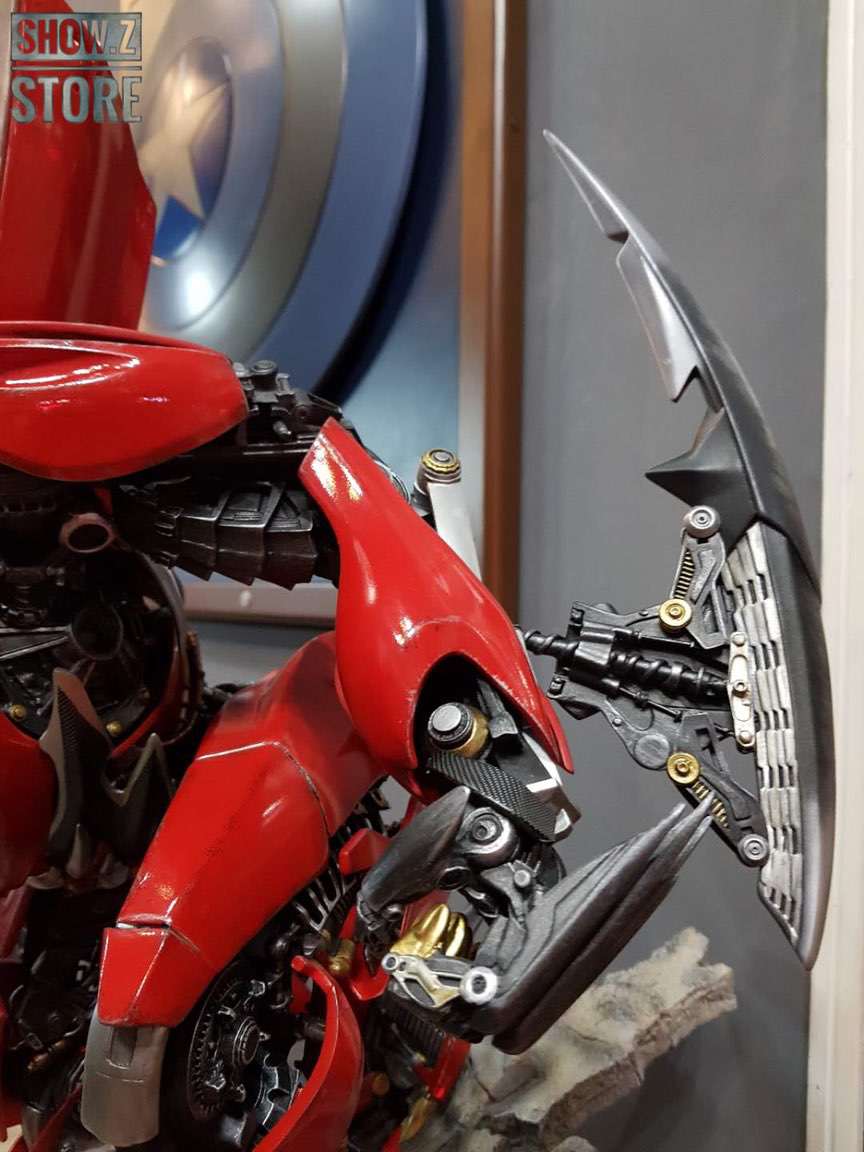 Red robot warrior figure with black armor detail Red robot warrior figure with black armor detail