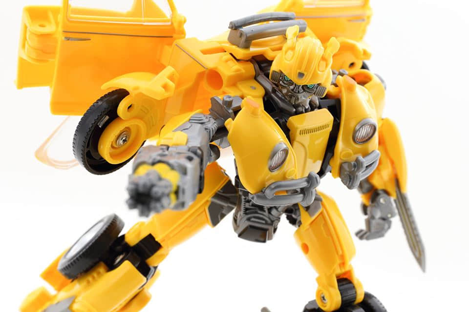 Yellow robot with black and gray detail sections Yellow robot with black and gray detail sections