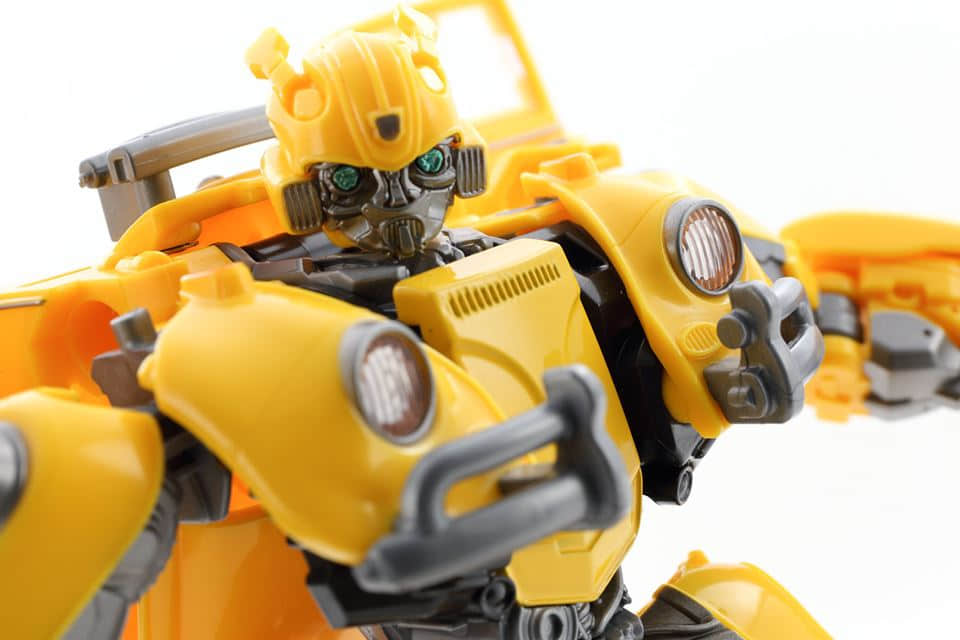 Yellow robot head with blue eyes and orange accents Yellow robot head with blue eyes and orange accents