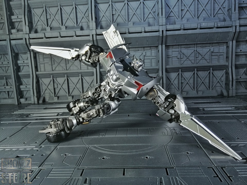 Detailed side view of white black red armed robot transformation Detailed side view of white black red armed robot transformation