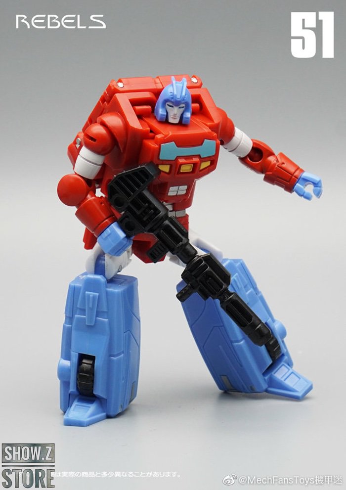 Orion Pax red blue warrior robot with yellow spikes and dual weapons Orion Pax red blue warrior robot with yellow spikes and dual weapons