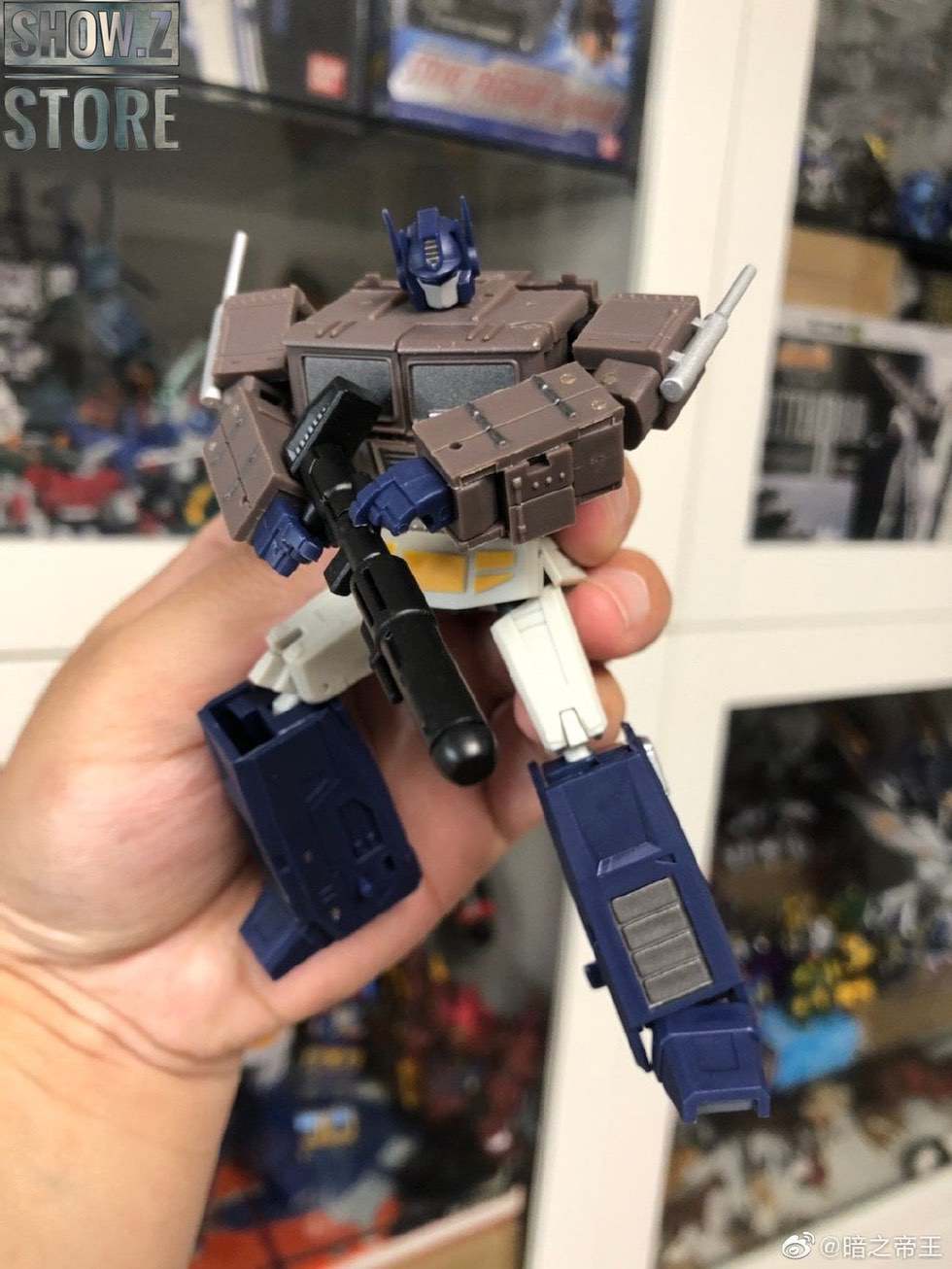 Optimus Prime transforming robot in blue and brown colors Optimus Prime transforming robot in blue and brown colors