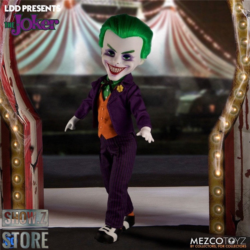 Joker character figure in purple suit holding red sign prop Joker character figure in purple suit holding red sign prop