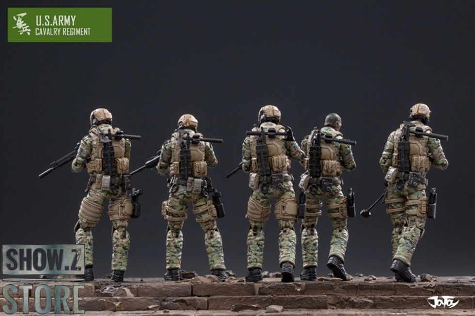 Five Army soldiers in tactical gear posing with weapons Five Army soldiers in tactical gear posing with weapons