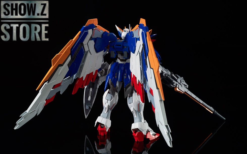 Wing Gundam side profile with orange beam rifle and wings extended Wing Gundam side profile with orange beam rifle and wings extended