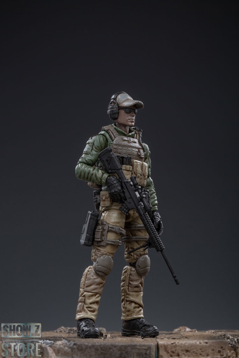 Five Marine soldiers in tactical gear tactical vests standing Five Marine soldiers in tactical gear tactical vests standing