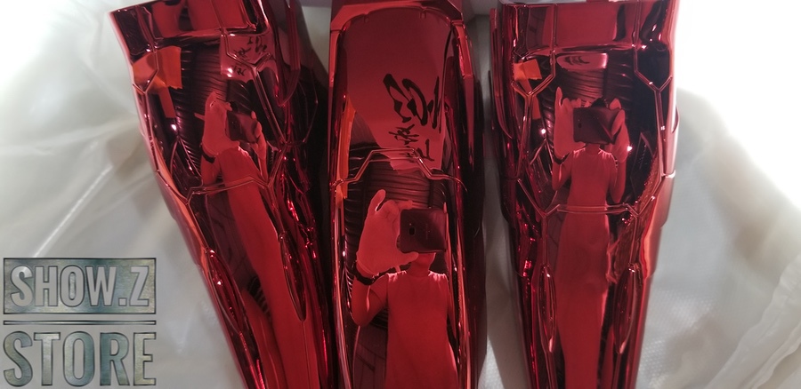 Red mobile suit displayed showing articulated leg panels Red mobile suit displayed showing articulated leg panels