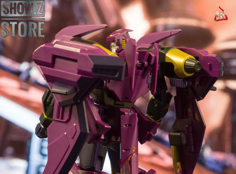 Purple and yellow mechanical transformer on blurred background Purple and yellow mechanical transformer on blurred background