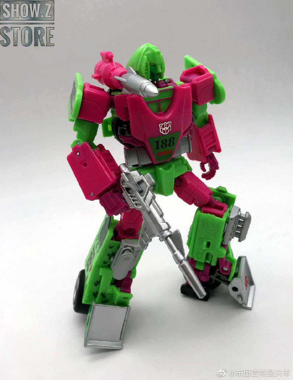 Red robot holding weapon staff in dynamic combat pose Red robot holding weapon staff in dynamic combat pose
