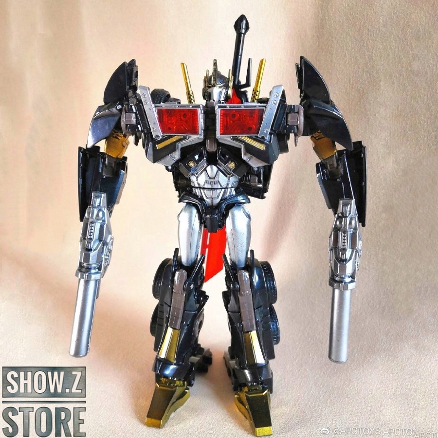 APC Toys Nemesis Prime black robot with red chest emblem standing APC Toys Nemesis Prime black robot with red chest emblem standing