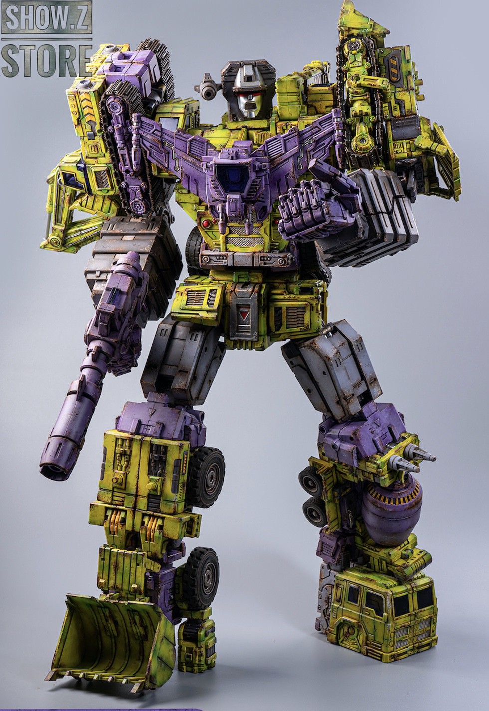 Constructor Devastator robot standing with yellow and purple metallic finish Constructor Devastator robot standing with yellow and purple metallic finish