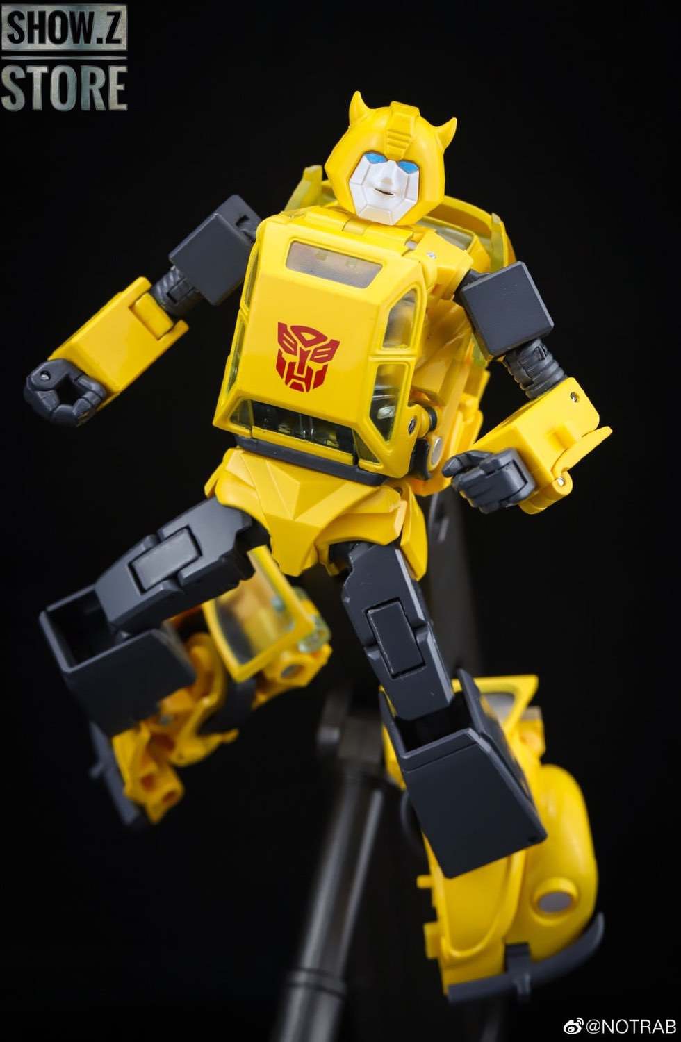 Yellow Bumblebee MP-45 robot with black and blue accents Yellow Bumblebee MP-45 robot with black and blue accents