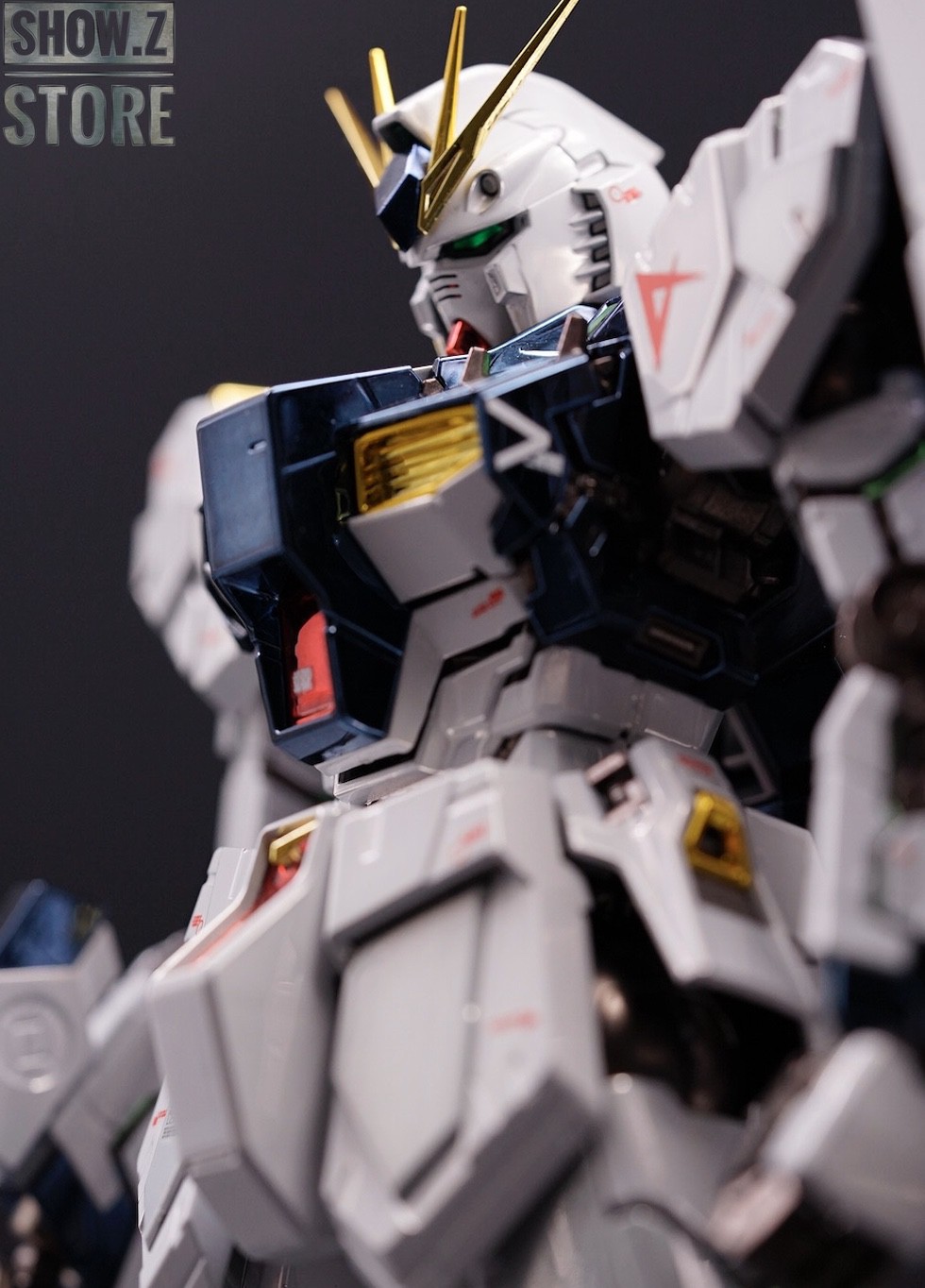 White mobile suit head close-up with yellow v-fin and LED sensors White mobile suit head close-up with yellow v-fin and LED sensors