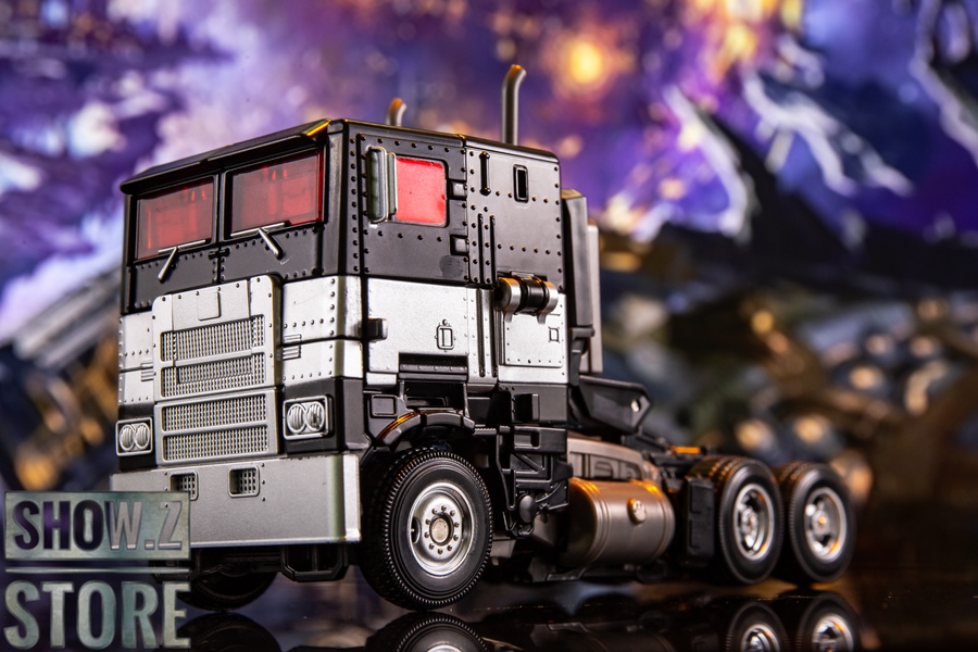 Nemesis Prime black mecha with intricate mechanical armor plating display Nemesis Prime black mecha with intricate mechanical armor plating display
