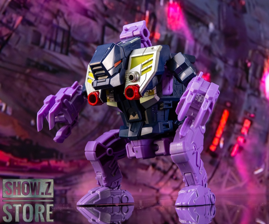 Small-scale purple robot figure with extended articulated appendages Small-scale purple robot figure with extended articulated appendages