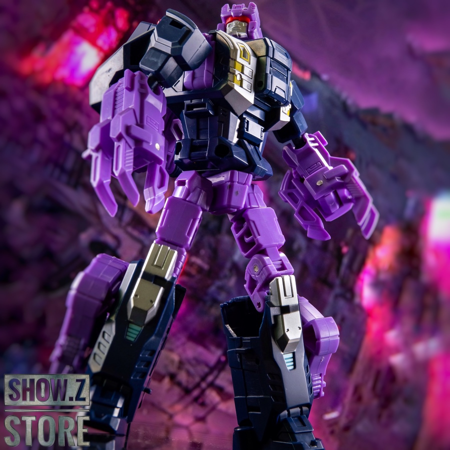 Purple and black mecha robot displayed in product packaging photo Purple and black mecha robot displayed in product packaging photo