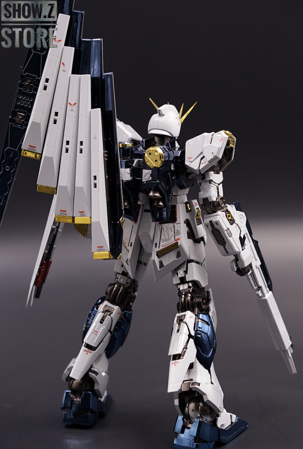 White gundam with extended beam weapons against dark background White gundam with extended beam weapons against dark background
